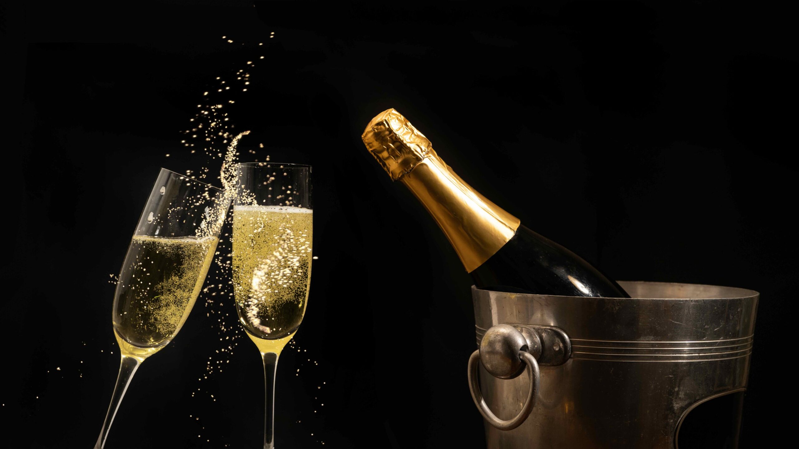 Champagne toast with clinking flutes, sparkling wine, ice bucket, celebration party, luxury event.