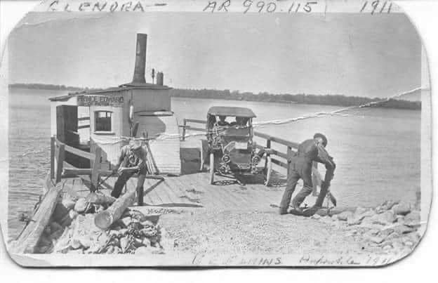 A vintage black-and-white image showcasing a historical outdoor event setup, featuring a boat, workers, and tools by a lakeside, emphasizing the art of hosting and event planning.