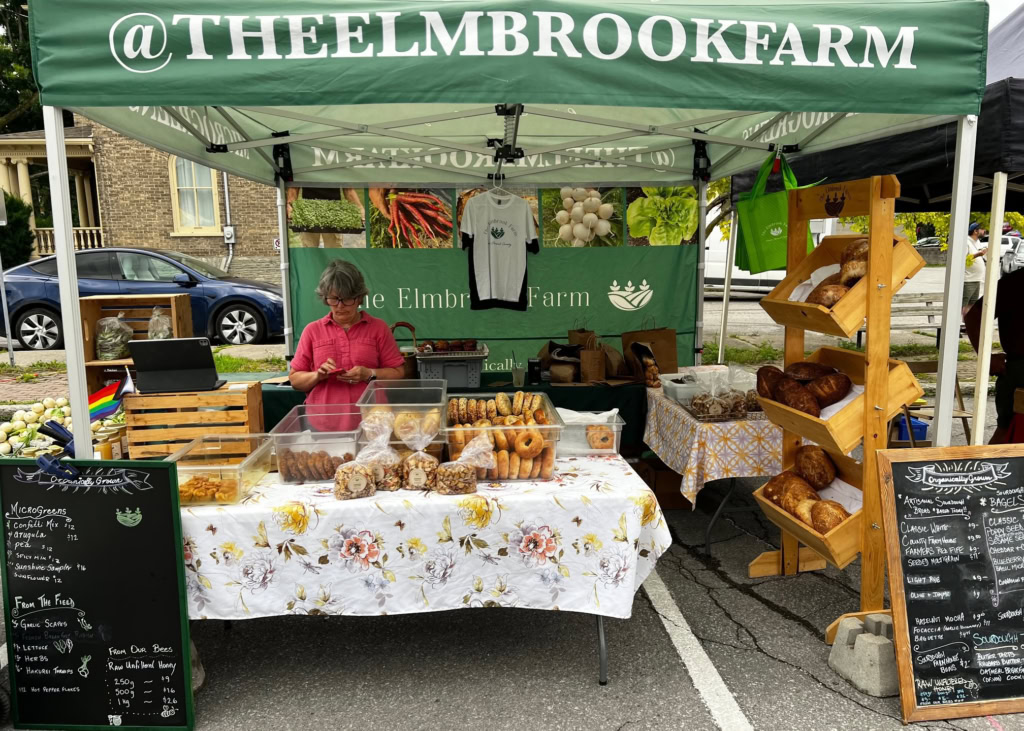 Bold and appealing bakery and farm products display at The Elmbrooke Farm stall.