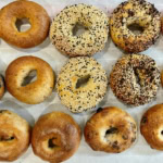 Freshly baked bagels with assorted toppings and flavors for breakfast or brunch.