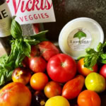 Vibrant heirloom tomatoes, fresh basil, cheese, and wine for gourmet dining.