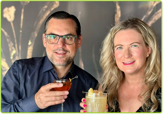 Happy friends celebrating at a stylish bar, enjoying cocktails and a sophisticated atmosphere.