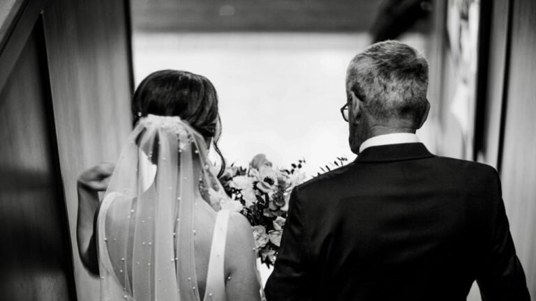 Father and daughter sharing a heartfelt wedding speech.