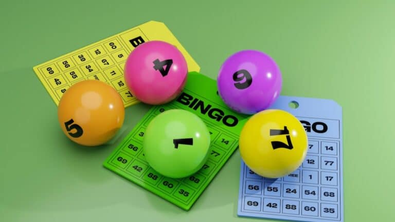 Colorful bingo cards and numbered lotto balls for game night at dinner parties.