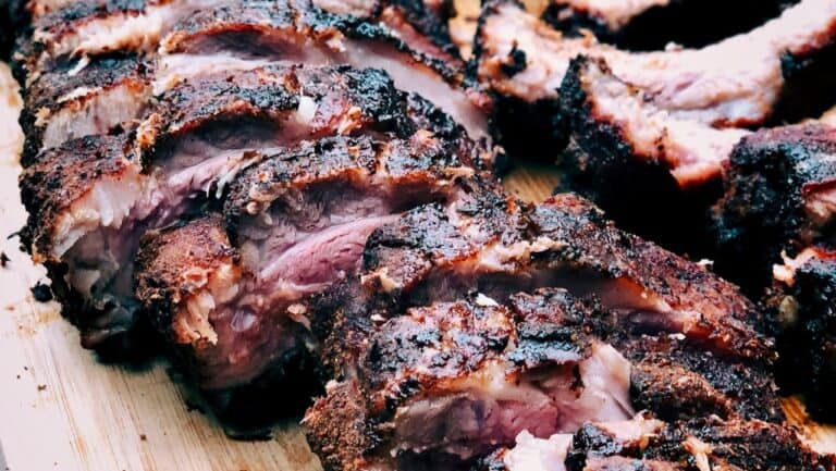 Smoked ribs with a flavorful, crispy bark and tender meat, perfect for barbecue enthusiasts.