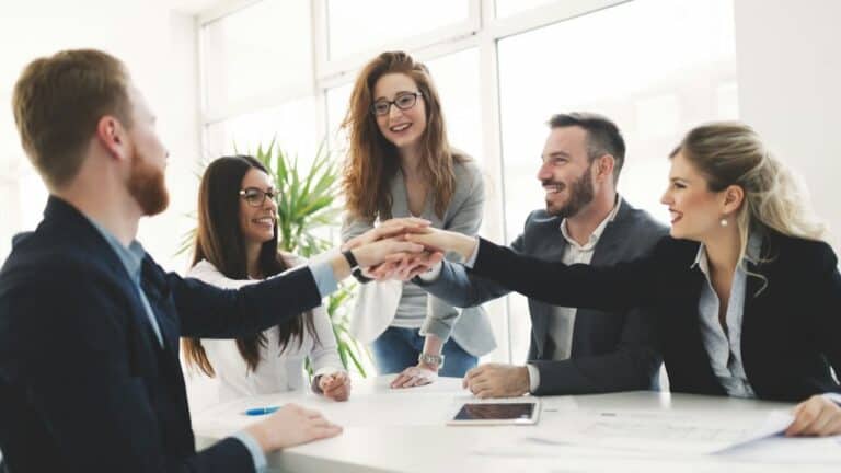 Group of diverse professionals engaging in a team-building icebreaker activity.