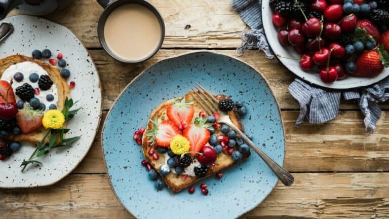 Delicious brunch toast topped with mixed fresh berries and edible flowers.