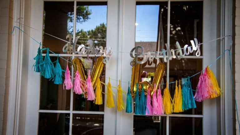 Colorful tassel and balloon decorations for dinner parties and celebrations.