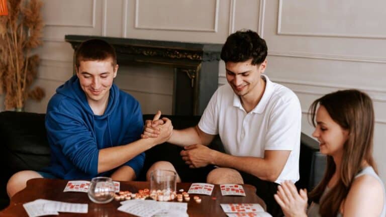 Group of friends playing engaging conversation games at home.