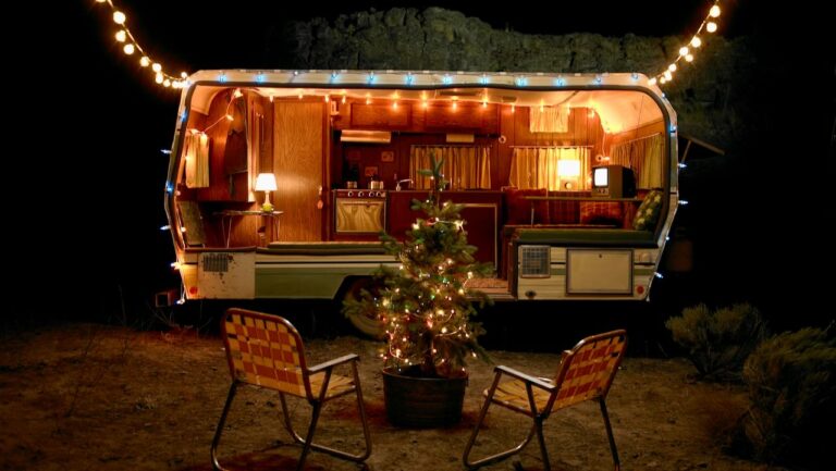 Outdoor home bar with warm lighting and festive decor.