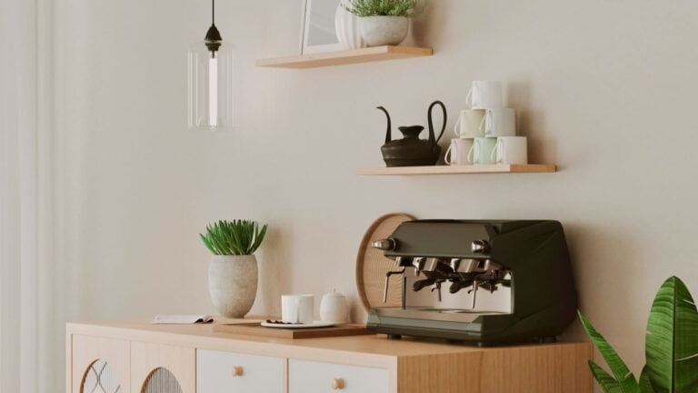 Stylish home coffee station with espresso machine and decor.