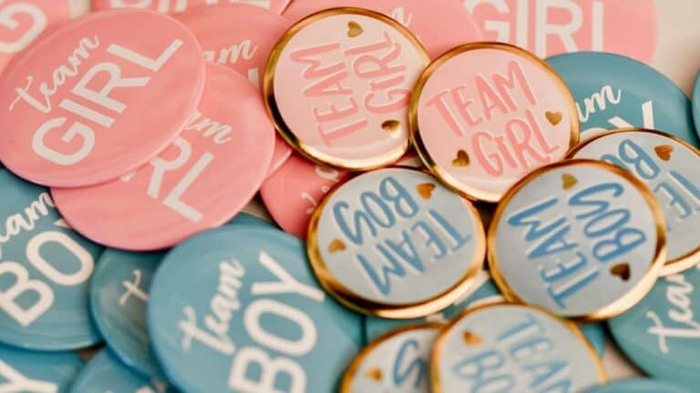 Colorful "Team Girl" and "Team Boy" buttons for baby shower guests.