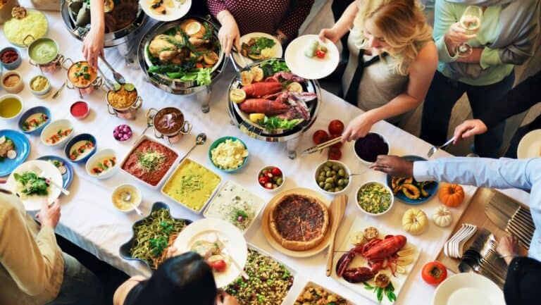 Gourmet buffet with seafood, salads, and appetizers at The Gourmet Host event.