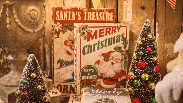 Festive Christmas greeting cards with decorated miniature Christmas trees and holiday ornaments.