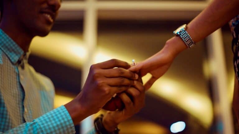 Groom proposes during engagement party with a ring exchange.