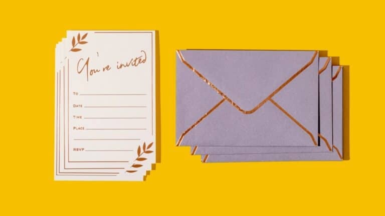 Elegant invitation cards and envelopes for a graduation celebration.