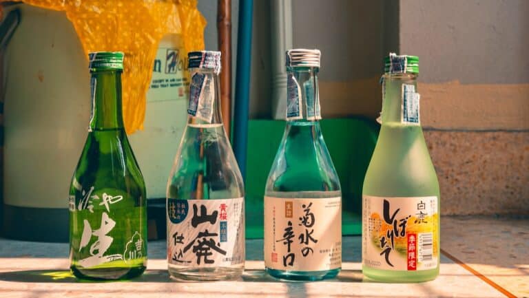Fresh Japanese sake bottles displayed outdoors, showcasing traditional beverage packaging and vibran.