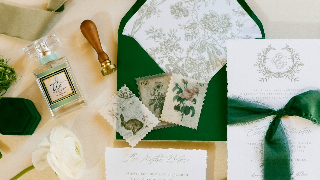 Elegant wedding invitation suite with floral motifs, green accents, and vintage postage stamps for a.