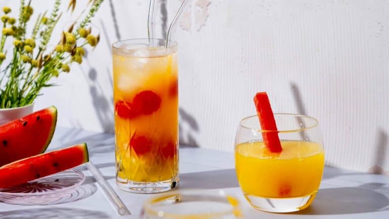 Refreshing Shirley Temple mocktail with cherry garnish and colorful fruit flavors.