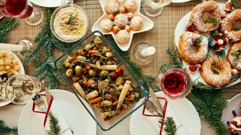 Festive brunch table with pastries, salads, and drinks for a holiday gathering.