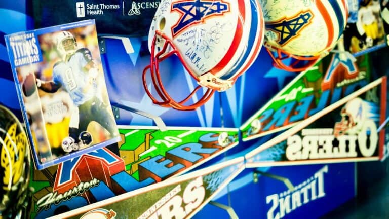 NFL helmets and Super Bowl memorabilia on display for Super Bowl food event.